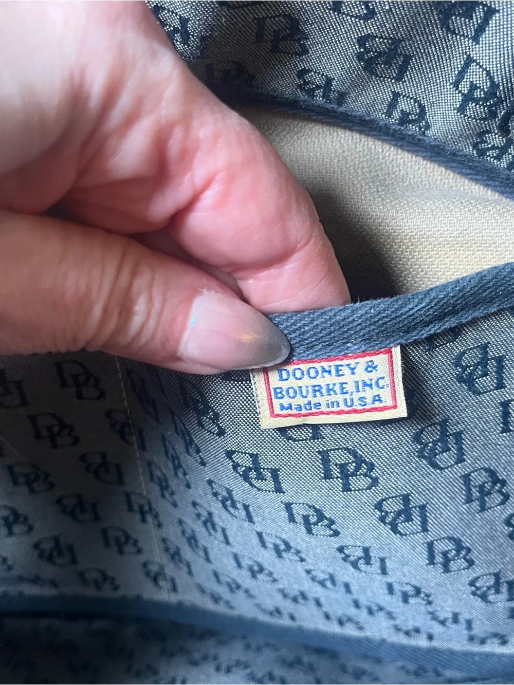 Dooney & Bourke Vintage Gray Canvas Monogram Tote with Black Trim and Tassel.